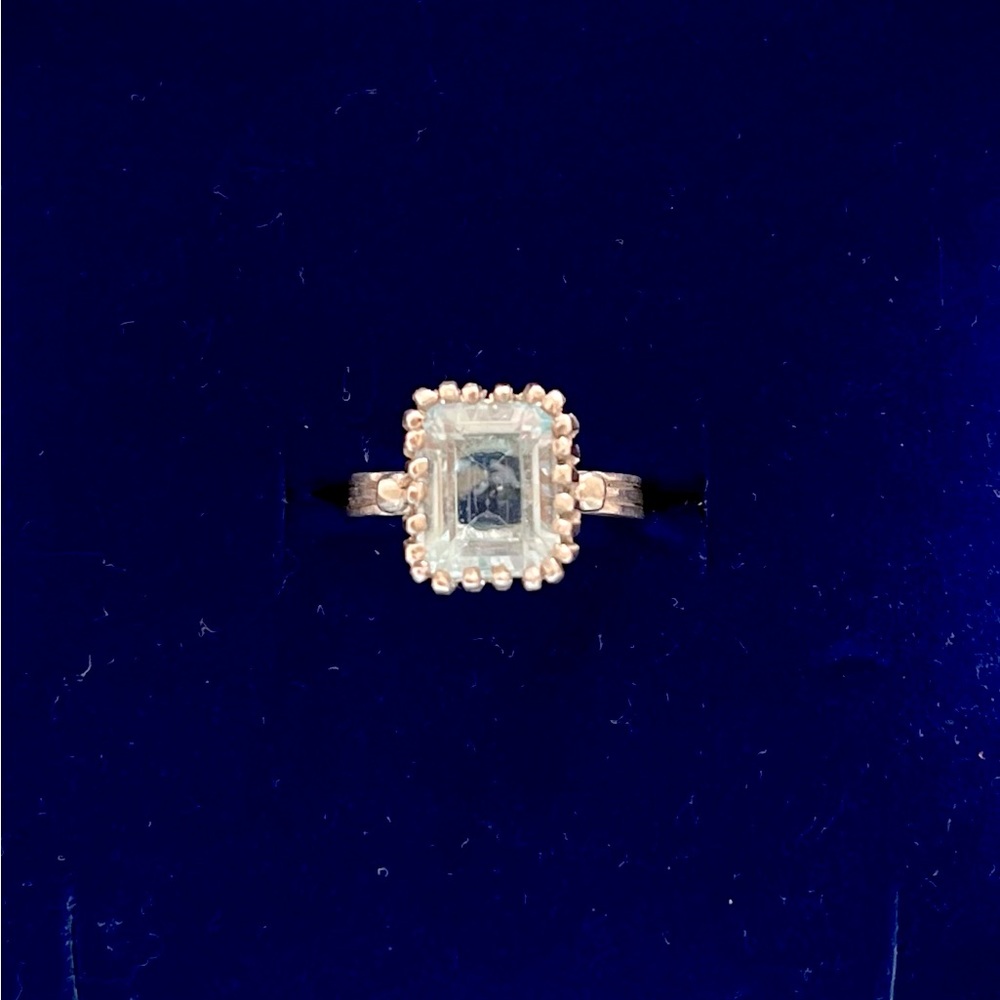 Sky blue topaz. Sterling Silver. Unique style setting. Size 7.5.